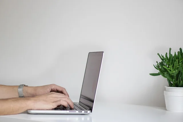 hands-typing-laptop-keyboard-office-work